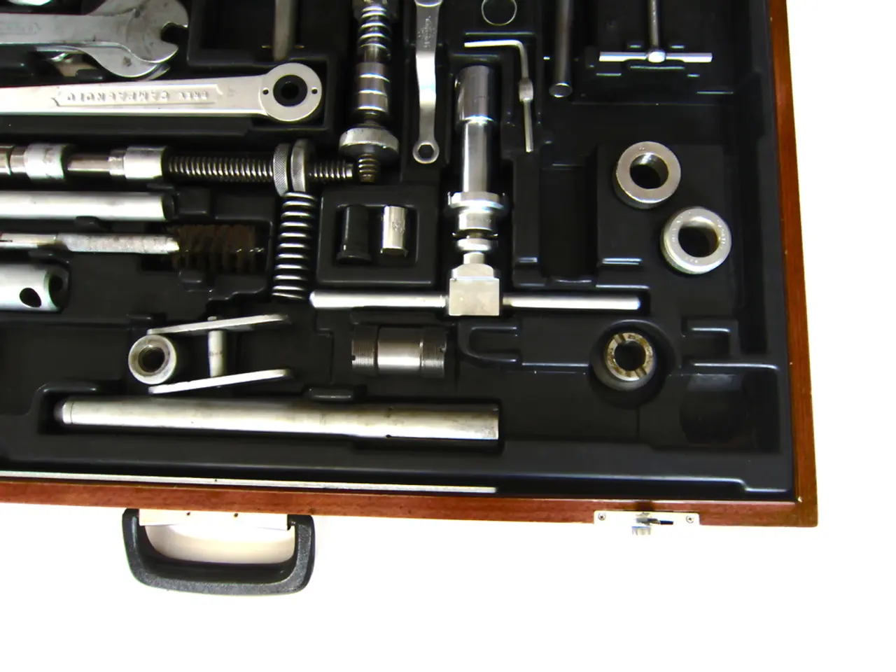 In this image we can see there is a tool box with so many tools in it.