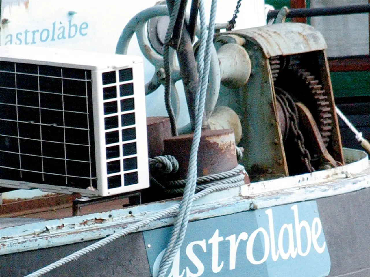 In this image in the front there is an object which is black in colour with some text written on it...