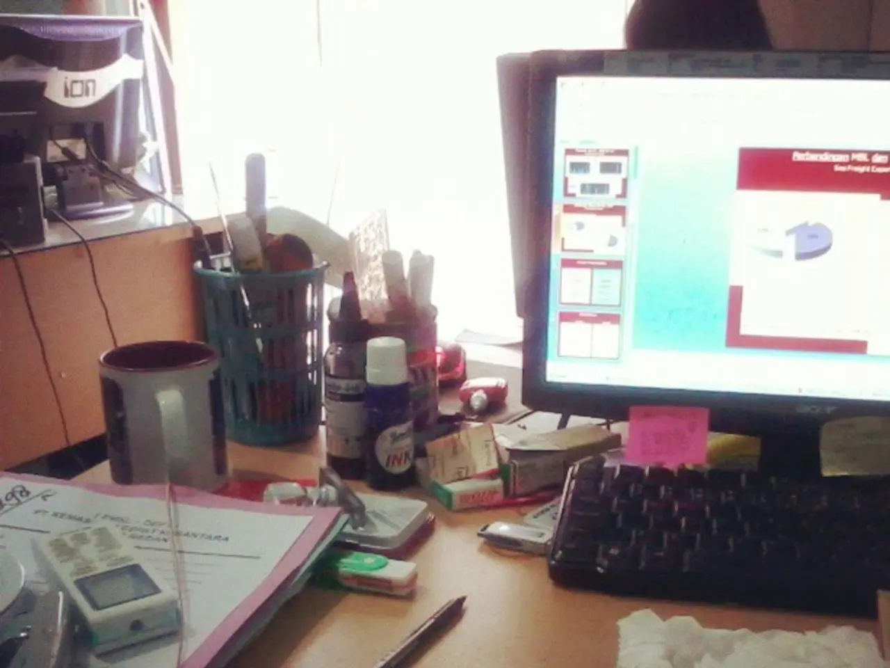 There is a table in this given picture on which monitor, keyboard, some accessories were placed on...