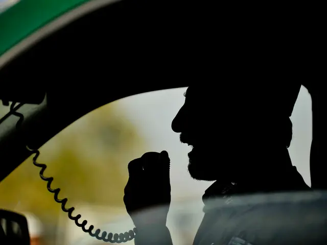 In this picture there is a person at the right side of the image, who is sitting in a car, he is...