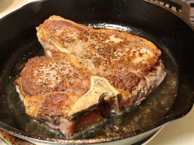 In this image we can see a food item on the pan, which is on the stove.