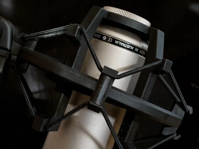 In the image there is a microphone which is in cream color and it is also having black color pillar...