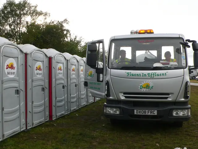 Right side of the image there is a vehicle on the grassland. Two persons are sitting inside the...