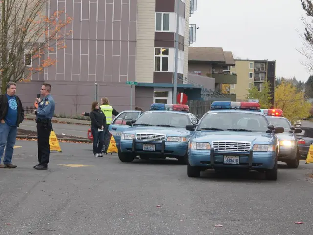 In this image, I can see the cars on the road. I can see four people standing. These are the...