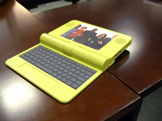 There is a table. There is a laptop on a table.